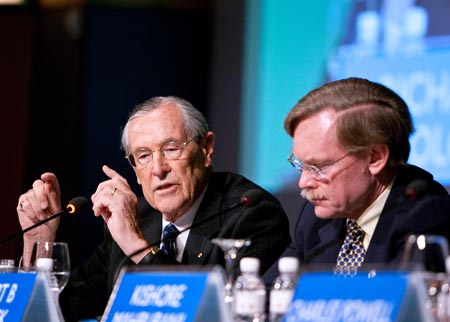 Richard Woolcott (L), former secretary of Australia's Department of Foreign Aggaires and Trade, speaks during the APEC 20th Anniversary High-Level Symposium in Singapore, November 10, 2009.