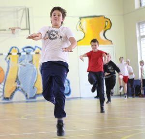 Photo taken on October 26, 2009 shows Dobrynin Denis (front) and his classmates have physical education lessons in Moscow, capital of Russia. 