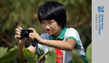 The undated photo shows Zhu Mengdan taking pictures in south China's Guangdong Province. 