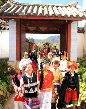 Dainzin Gyayang (2nd R, front) plays with his companions in the Lijiang Ethnic Orphanage in Lijiang City, southwest China's Yunnan Province, October 25, 2009.