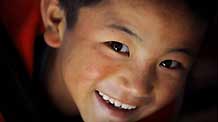 The photo taken on October 24, 2009 shows the bright and clean eyes of Dainzin Gyayang, an orphan in the Lijiang Ethnic Orphanage in Lijiang City, southwest China's Yunnan Province.