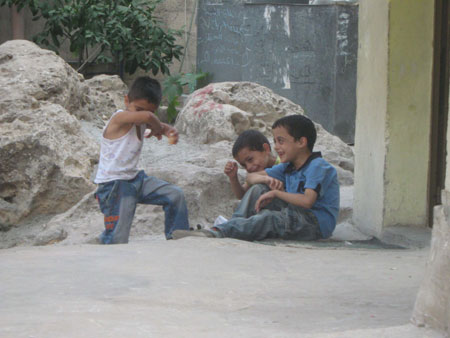 My name is Tala Nasser Ramadan, 11 years old. I live in Daheisheh refugee camp in the West Bank city of Bethlehem and study at a United Nations school in the camp. This photo taken on October 19, 2009 shows the boys became shy when I took photos for them. 