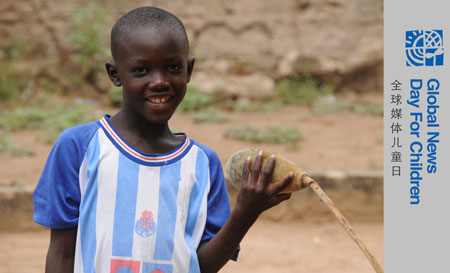 Photo taken on October 27, 2009 shows seven-year-old Lamine standing in a village 80 kilometers north of Dakar, capital of Senegal. 