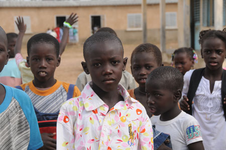 Seven-year-old Lamine poses with his schoolmates at school in a village 80 kilometers north of Dakar, capital of Senegal, October 27, 2009. 