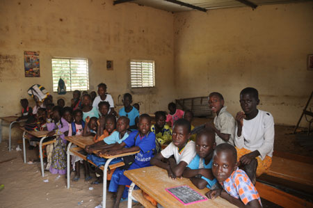 Seven-year-old Lamine poses with his schoolmates at school in a village 80 kilometers north of Dakar, capital of Senegal, October 27, 2009.