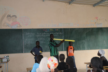 Lamine's teacher gives a math class at school in a village 80 kilometers north of Dakar, capital of Senegal, October 27, 2009. 