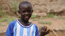 Photo taken on October 27, 2009 shows seven-year-old Lamine standing in a village 80 kilometers north of Dakar, capital of Senegal.