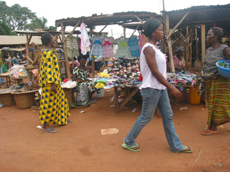 The photo taken on October 28, 2009 shows local residents trade at the market in Togoville. Wednesday is the busiest time of a week. At this market barter trade that has died out in most of the markets, is still performed as fishers barter their fishes for grain products from local farmers without using any cash. 