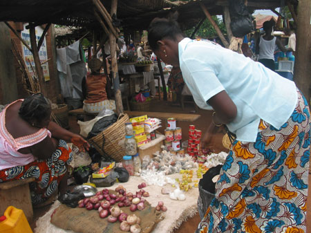 The photo taken on October 28, 2009 shows a customer asks for price at the market in Togoville.