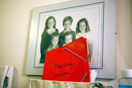 A photo of George and his sisiters and brother is displayed at home in Paris, November 7, 2009.