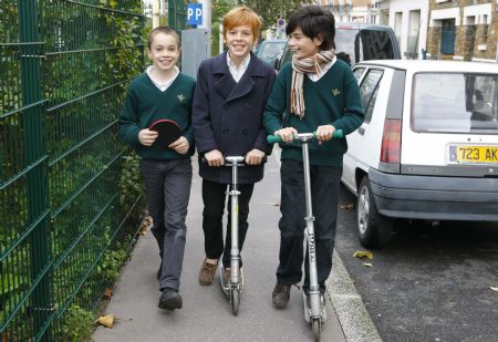 George and his classmates are on their way to school in Paris, November 8, 2009.