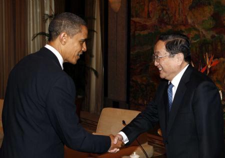 US President Barack Obama(L) meets with Yu Zhengsheng, member of the Political Bureau of the Communist Party of China (CPC) Central Committee and secretary of the CPC Shanghai Municipal Committee, at the Xijiao State Guest House in Shanghai, November 16, 2009.