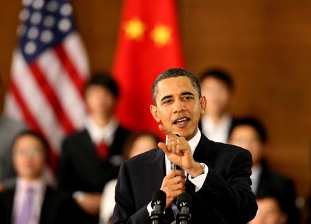 US President Barack Obama gestures as he delivers a speech at a dialogue with Chinese youth at the Shanghai Science and Technology Museum during his four-day state visit to China, November 16, 2009.