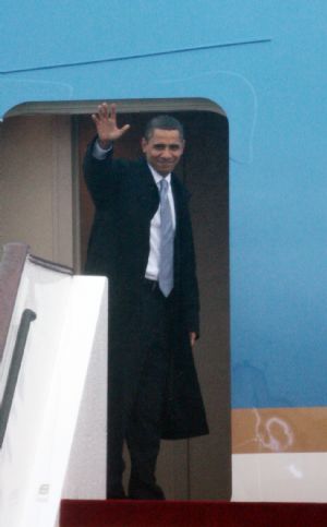 US President Barack Obama waves as he leaves to Beijing in Shanghai, November 16, 2009. 