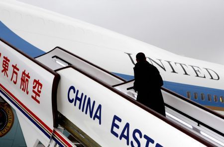 US President Barack Obama gets aboard as he leaves to Beijing in Shanghai, November 16, 2009. 