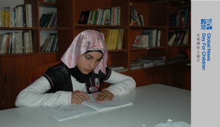 Photo taken on October 29, 2009 shows Sahar Karmo (1st R) reading a book in a library.Every afternoon, the 12-year-old Sahar Karmo goes to the Youth and Children Center in Beirut's Shatila Palestinian Refugee Camp for free education. The Center is not a formal school but a training institution for those children who perform poorly in schools.