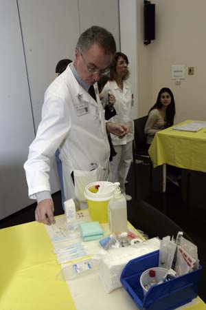 A doctor prepares to take A/H1N1 flu vaccination in Athens, capital of Greece, November 16, 2009. The vaccination program against A/H1N1 flu began in Greece on Monday.