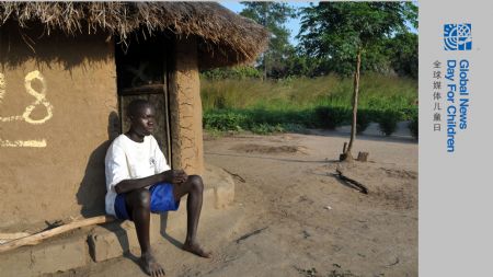 Denis Opoka sits in front of his hut at Ajulu village, in Gulu district, northern Uganda, on October 20, 2009.