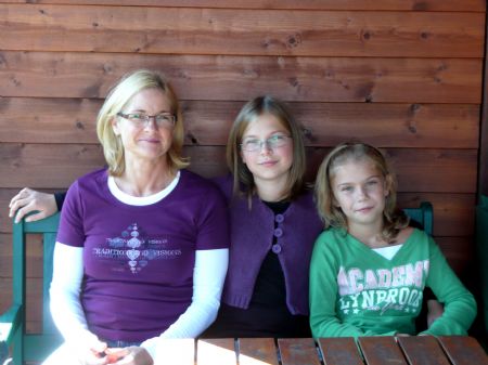 Flora (C) and Valentina (R) pose for a group photo with their mother at their home in Purkersdorf, a town of Lower Austria, Austria, on October 4, 2009. 