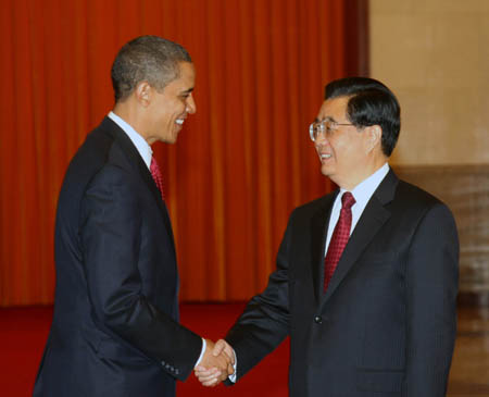 Chinese President Hu Jintao welcomes visiting US President Barack Obama at the Great Hall of the People in Beijing on November 17, 2009. 