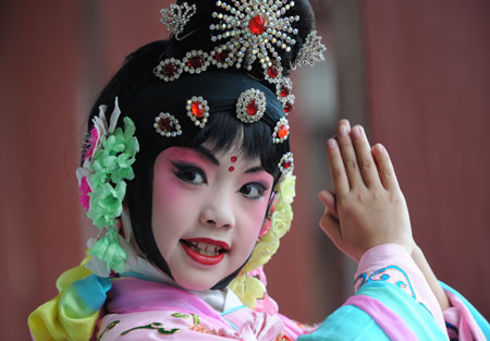 Liu Chenyan practises before a show in her school in Nanjing, east China's Jiangsu Province, October 26, 2009. 