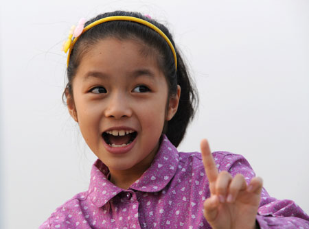 Liu Chenyan practises in the community of her home in Nanjing, east China's Jiangsu Province, October 24, 2009.