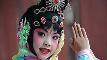 Liu Chenyan practises before a show in her school in Nanjing, east China's Jiangsu Province, October 26, 2009.