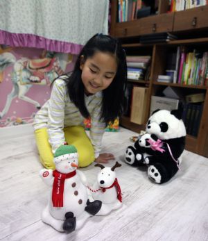 South Korean girl Lin Su Ting plays with her toys at home in Seoul, capital of South Korea, November 1, 2009.