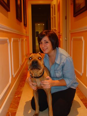 The picture taken on November 2, 2009 shows my elder sister with her pet dog at home.