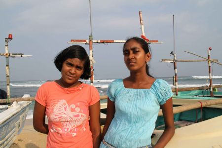 Photo taken on October17, 2009 shows Heshani and her sister near a beach in Sri Lanka.