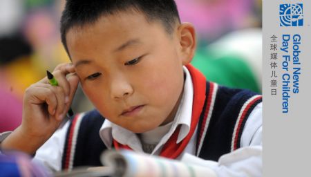 Xu Zhongzheng studies by himself during break in the New Primary School of Dujiangyan City of Chengdu, capital of southwest China's Sichuan Province, November 11, 2009. 