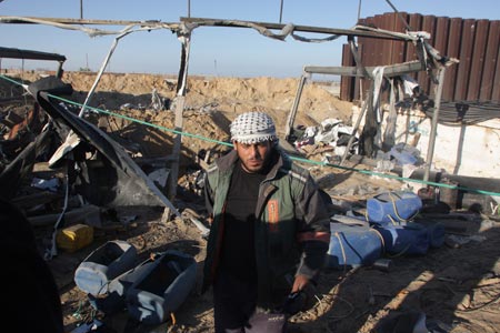 A Palestinian man inspects damages of underground tunnels on Gaza's southern border with Egypt following Israeli airstrikes November 19, 2009. Israeli jets attacked on Thursday morning a building and two tunnels, wounding three people in southern Gaza Strip in response to Palestinian rocket-fire on Israeli territories. 