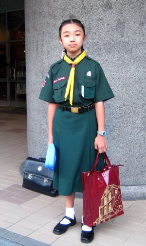 My hobbies are studying Chinese and swimming. Photo taken on October 27, 2009 shows I am wearing my school uniform.