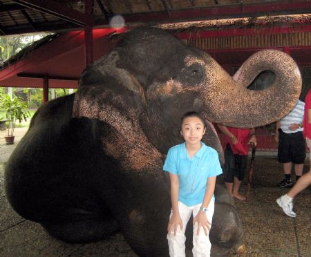 Photo taken on October 22, 2009 shows I am posing with an elephant after the show.