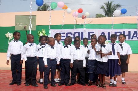 Pupils sing during a celebration for the Universal Children's Day in Lome, capital of Togo, November 18, 2009. Teachers and pupils of a primary school in Lome held the celebration to mark the Universal Children's Day and commemorate the 20th anniversary of the adoption of 'Convention on the Rights of the Child'. 