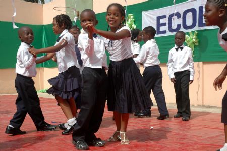 Pupils attend a celebration for the Universal Children's Day in Lome, capital of Togo, November 18, 2009. 