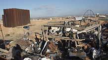 Palestinians inspect damages of underground tunnels on Gaza's southern border with Egypt following Israeli airstrikes November 19, 2009.