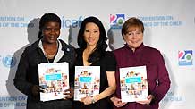 (R to L) Ann M. Veneman, executive director of the UN Children's Fund (UNICEF), UNICEF Goodwill Ambassador and actor Lucy Liu and Grace Akallo, former child soldier from Uganda, show 'The State of the World's Children' reports to the media during a news conference at the UNICEF headquarters in New York November 19, 2009.