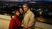 Rasa forouzan (L), a 12-year-old Iranian girl, poses with her parents, in Teheran, capital of Iran, November 19, 2009.