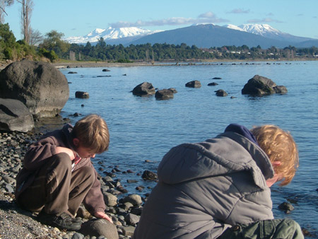 The picture shows two pupils amuse themselves at the bank of a lake on North Island, New Zealand. New Zealand is a country with beautiful natural sceneries. My name is Maria and I was born on July 8, 1998 to a family of five. I am a primary school pupil at Hart and I love reading very much. 