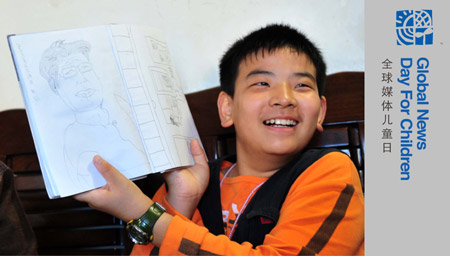 Liu Danyang, shows his painting My Grandma at his home on November 1, 2009 in Yichang, city of central China's Hubei Province.