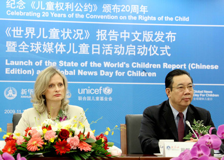 United Nations Children's Fund (UNICEF) China Officer-in-Charge and Chief of Social Policy and Economic Analysis Hana Brixi (L) and Xinhua News Agency Vice-President Zhou Xisheng attend the launch ceremony of the State of the World's Children Report (Chinese-Edition) in Beijing, capital of China, November 20, 2009. 