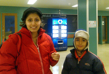 A boy and his mother are seen at a Chinese-language school in Toronto October 31, 2009.