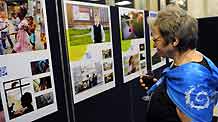 A visitor looks at the photos during a photo exhibition marking the Universal Children's Day at the headquarters of the United Nations (UN) in New York, the US, November 19, 2009.