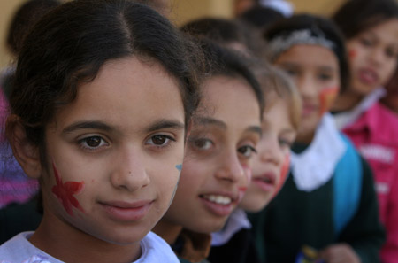 Palestinian children have their faces painted and gather to commemorate the Universal Children's Day, which falls on Friday, near their home, south of Gaza City, November 19, 2009. 