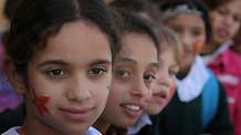 Palestinian children have their faces painted and gather to commemorate the Universal Children's Day, which falls on Friday, near their home, south of Gaza City, November 19, 2009.