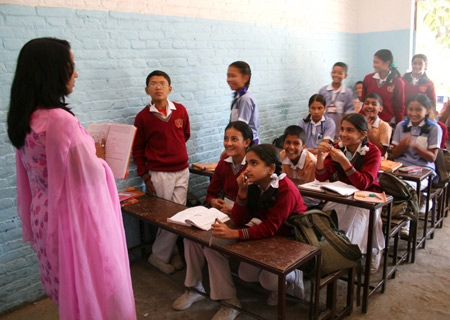 Jyoti Upreti (R, 2nd row) attends a class in Kathmandu, capital of Nepal, on October 28, 2009. 