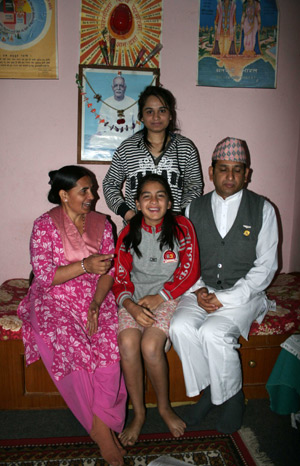 Jyoti Upreti poses for a group photo with her parents and sister at home in Kathmandu, capital of Nepal, on October 28, 2009.