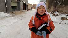 Ma Siqi goes to school in Dongxiang Autonomous County, northwest China's Gansu Province, on November 20, 2009. Ma Siqi, a 10-year-old girl of Dongxiang ethnic group, enjoyed herself with her classmates at school on the Universal Children's Day of November 20.