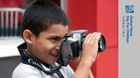 Eduardo Loayza takes photo with his camera in Panama, October 23, 2009. Nine-year-old Eduardo Loayza is a third grade pupil whose father is a taxi driver. He fell in love with photography the first time he put hands on a camera. On November 4, the Panama's Flag Day, he took his camera to shoot the parade. He wishes to be a photographer when he grows up.